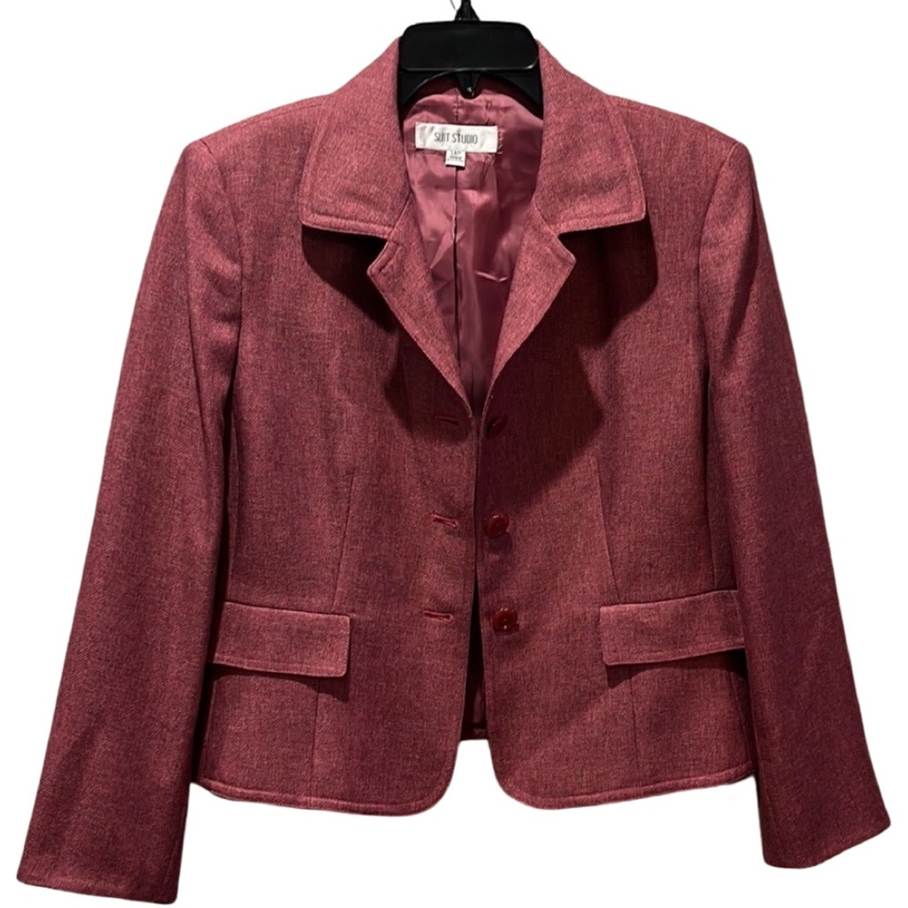 Tailored suit by Suit Studio.